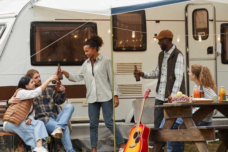 friends-relaxing-by-rv-van-outdoors.jpg